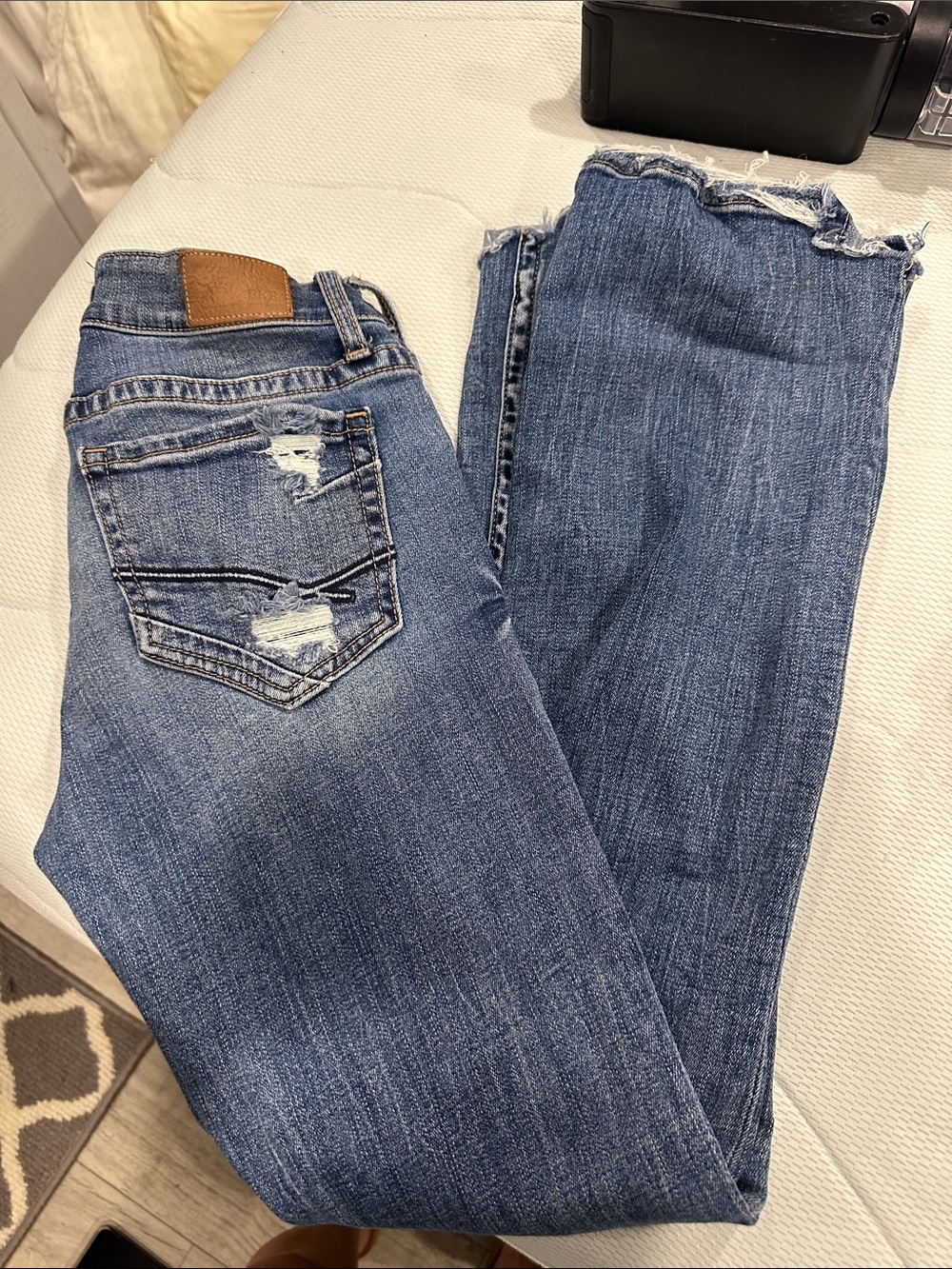 BKE Women's Blue Boot Cut Jeans with Raw Hem and Distressing